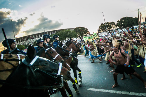 Natives clash with mounted riot cops, May 27, 2014.