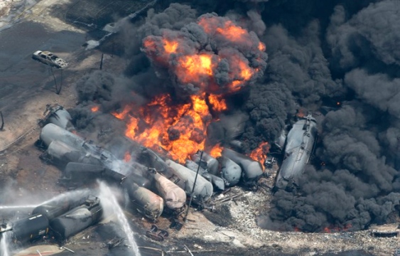 Train cars carrying crude oil burn after derailing in Lac Megantic, Quebec, July 2013.