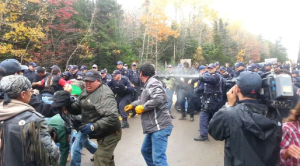 RCMP pepper spray crowd at blockade, Oct 17, 2013.