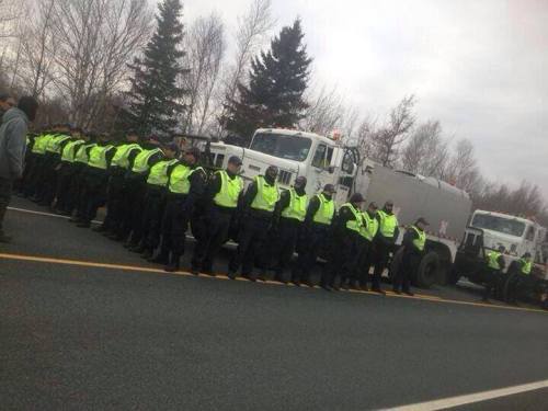 RCMP surround "thumper" seismic testing vehicles contracted by SWN Resources, Nov 14, 2013.
