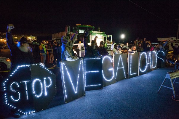 Some kind of reflective material appears to have been used in this banner, blockade of Port of Umatilla, Dec 2, 2013.