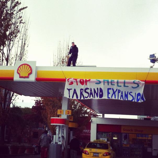 Banner drop on Shell station in Vancouver, Oct 23, 2012.