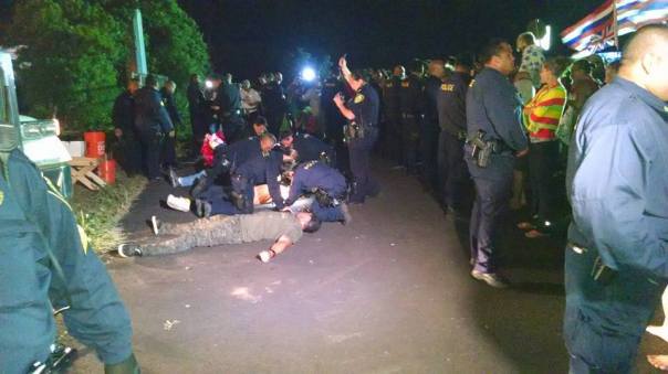 Police begin arresting protesters. Photo: Maui Now.